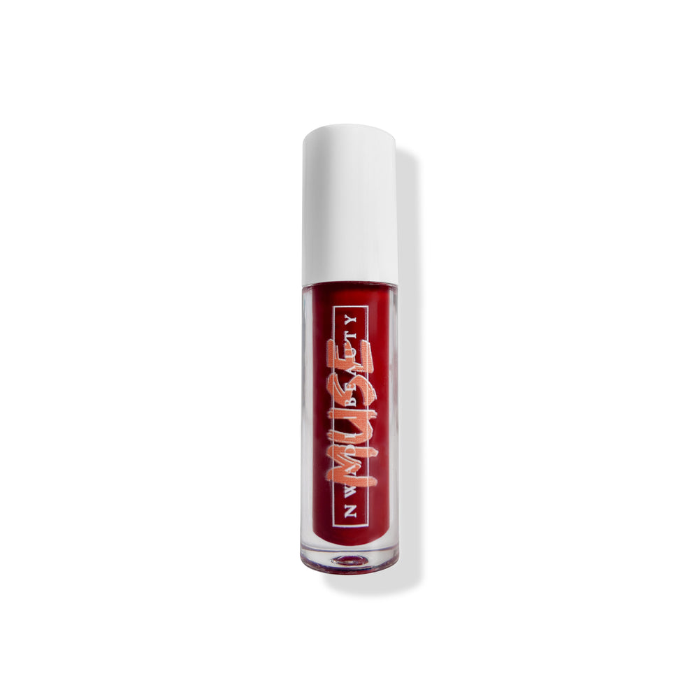 
                  
                    Matte Muse lip gloss on melanin-rich lips with velvet finish
                  
                