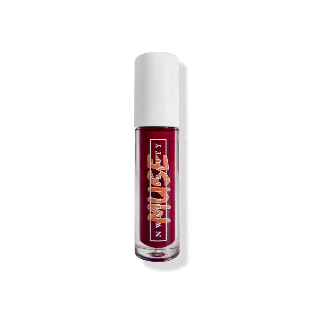 
                  
                    Matte Muse lip gloss on melanin-rich lips with velvet finish
                  
                