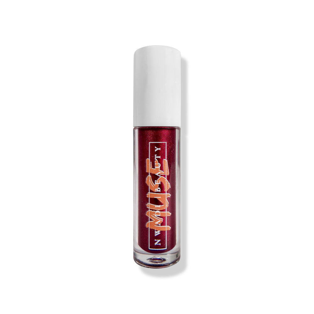 
                  
                    Matte Muse lip gloss on melanin-rich lips with velvet finish
                  
                