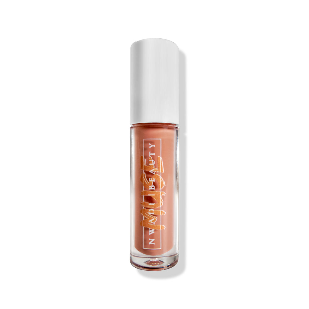 
                  
                    Matte Muse nude lip gloss on melanin-rich lips with velvet finish
                  
                