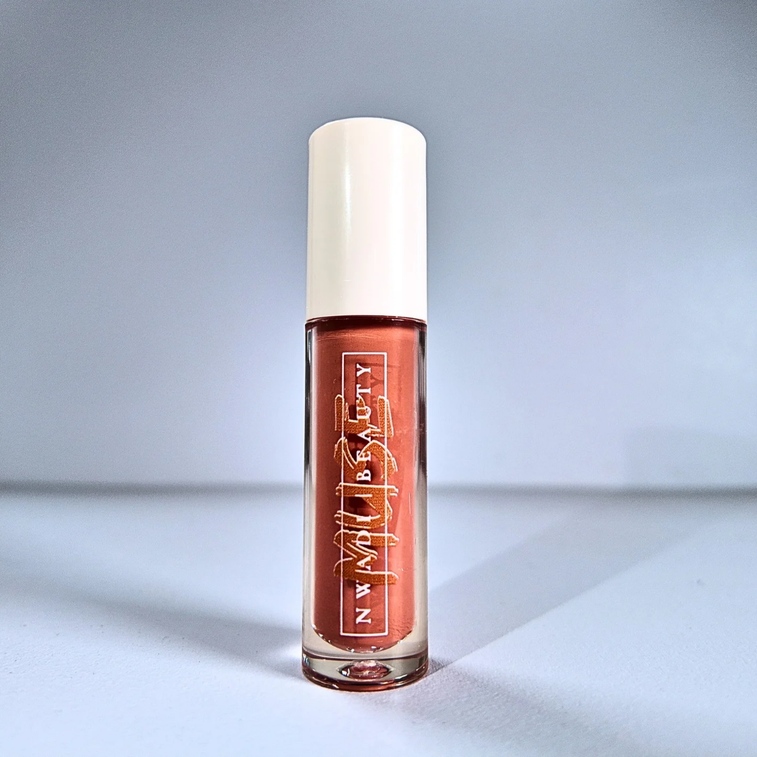 Matte Muse nude lip gloss on melanin-rich lips with velvet finish