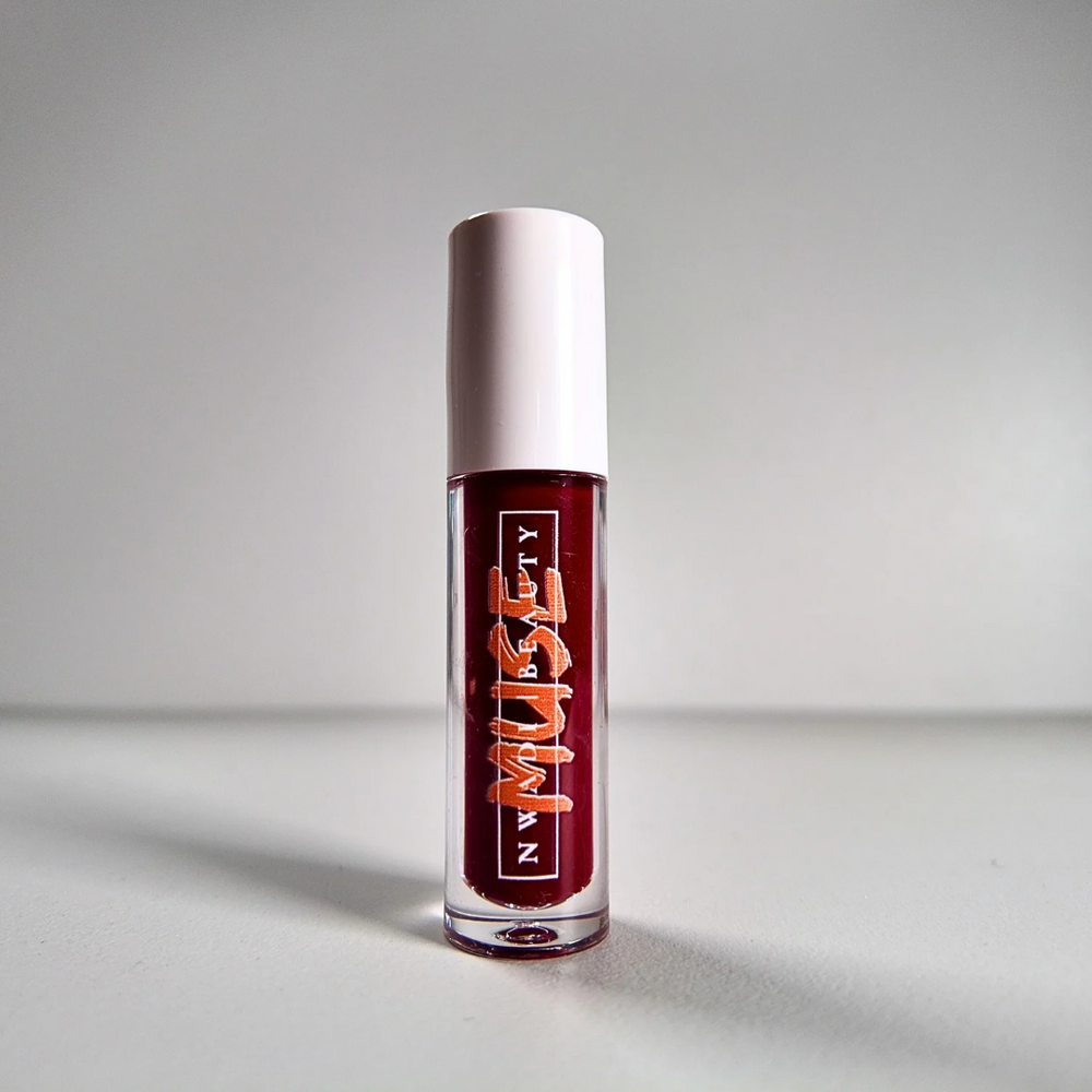 
                  
                    Matte Muse nude lip gloss on melanin-rich lips with velvet finish
                  
                