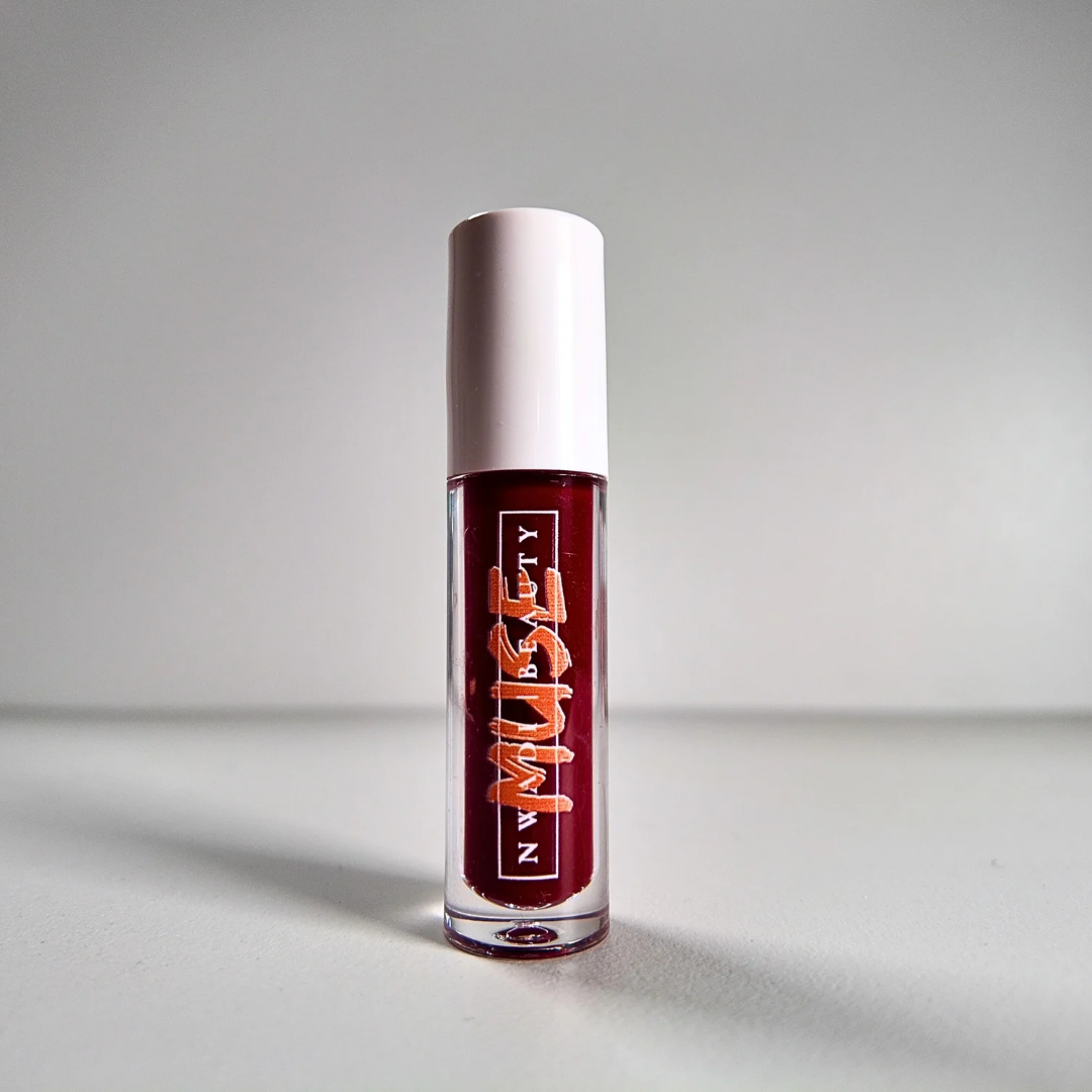 Matte Muse nude lip gloss on melanin-rich lips with velvet finish