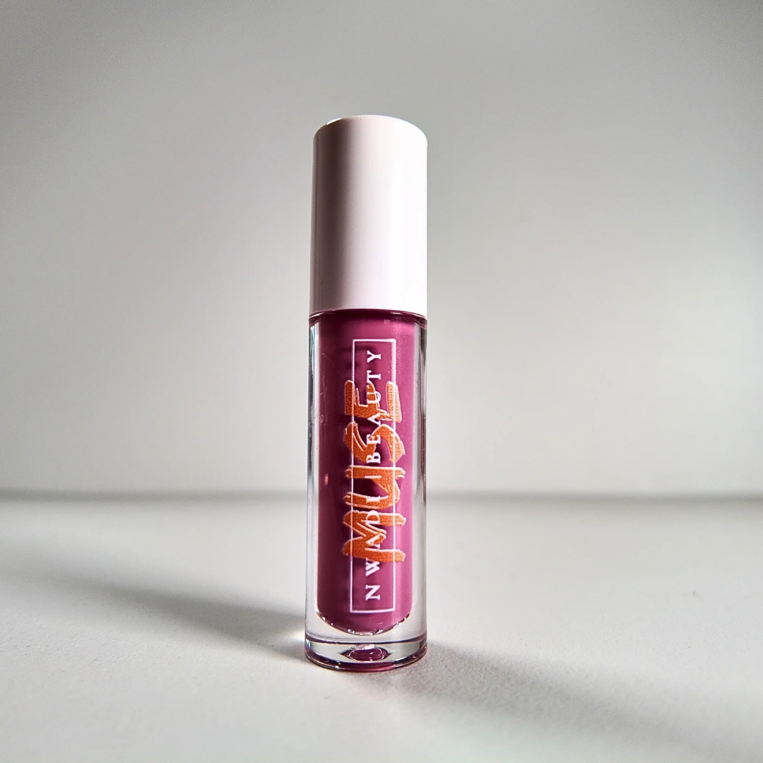 Matte Muse nude lip gloss on melanin-rich lips with velvet finish