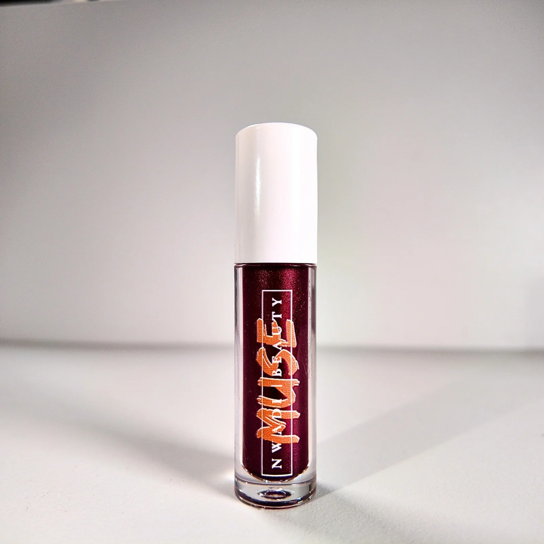 Matte Muse nude lip gloss on melanin-rich lips with velvet finish