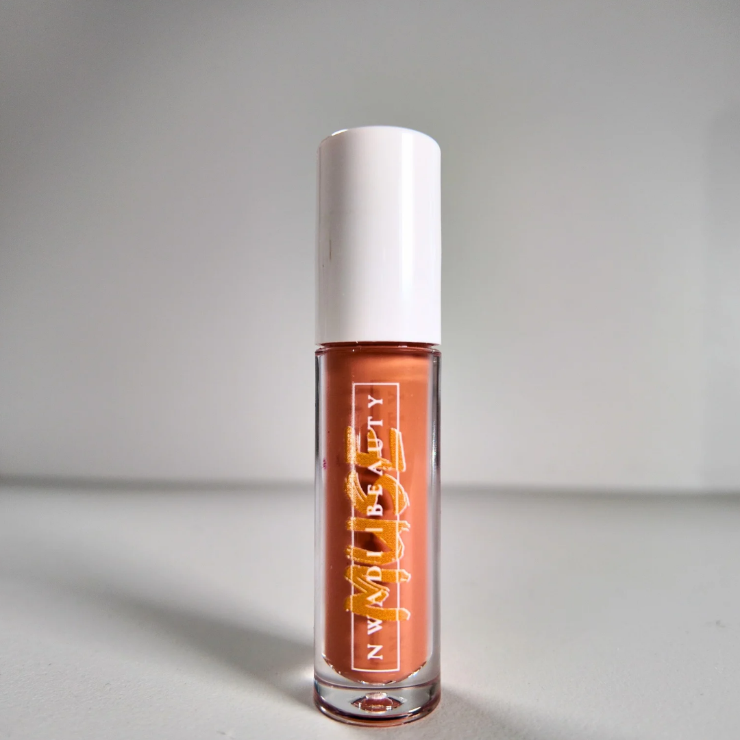 Matte Muse nude lip gloss on melanin-rich lips with velvet finish